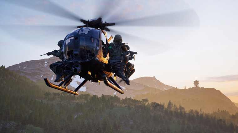 A Littlebird helicopter carrying troops on its skids flies over forested hills at sunset